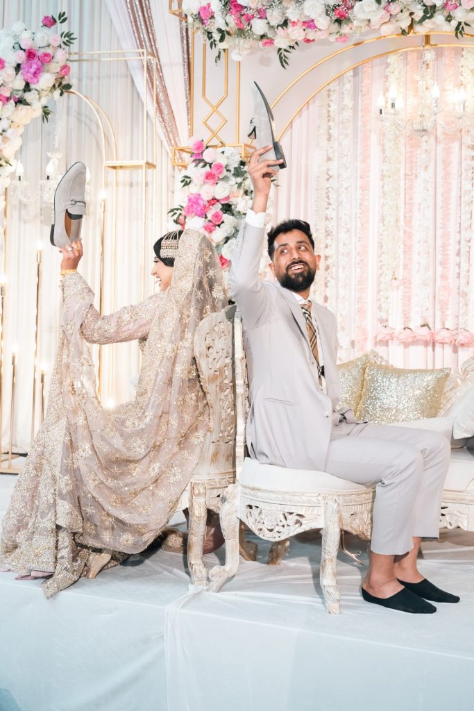 Wedding Couple holding shoes photoshoot Mississauga